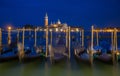 Gondolas in night time at Piazza San Marco, Venice, Italy. Royalty Free Stock Photo