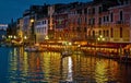 Gondolas and Other Boats are Tied Up At Night in Front of Restaurants along the Grand Canal in Venice