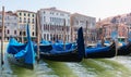 Gondolas parked on Venice Grand Canal on the opposite of Palazzo Loredan and Palazzo Dandolo Farsetti Royalty Free Stock Photo