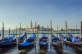 Gondolas pier row anchored on Canal Grande in Venice, Italy Royalty Free Stock Photo