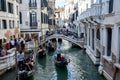 Gondolas sail along a canal in Venice