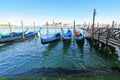 Gondolas at their moorings in the evening in Venice, Italy Royalty Free Stock Photo