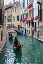 Gondolas with tourists in Venice, Italy