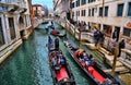 Gondolas with tourists in Venice, Italy