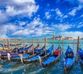 Gondolas in Venice against San Giorgio Maggiore church in Italy