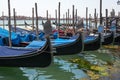 Gondolas in Venice. The gondolas are moored at the mooring posts. Venice, Italy. Royalty Free Stock Photo