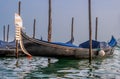 Gondolas in Venice. The gondolas are moored at the mooring posts. Venice, Italy. Royalty Free Stock Photo