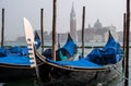 Gondolas in Venice. The gondolas are moored at the mooring posts. Venice, Italy. Royalty Free Stock Photo