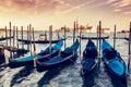 Gondolas in Venice, Italy at sunset. Royalty Free Stock Photo