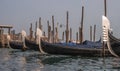 Gondolas in Venice. The gondolas are moored at the mooring posts. Venice, Italy. Royalty Free Stock Photo