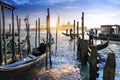 Gondolas in Venice and sunset behind San Giorgio Maggiore church Royalty Free Stock Photo