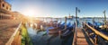 Gondolas in Venice - sunset with San Giorgio Maggiore church. San Marco, Venice, Italy