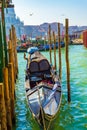 Gondolas wooden moorage of San Marco Ferry terminal at Grand Canal Venice