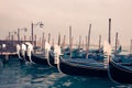 Gondolas and wooden pier in winter in Venice Italy Royalty Free Stock Photo