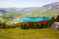 Gondolas of Zwoelferhorn Seilbahn cable way and a view of alpine village St.Gilgen and Wolfgangsee lake, Austria Royalty Free Stock Photo