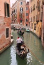 Gondole in a canal of Venice