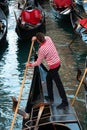 Gondolier amongst gondolas in Venice