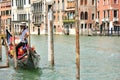 Gondolier on his gondola boat in Venice , Italy waiting for tourists Royalty Free Stock Photo