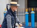 Gondolier on Canal Grande, Venice, Italy