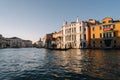 Gondolier is driving a gondola with people  on the Grand Canal of Venice, Italy Royalty Free Stock Photo