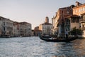 Gondolier is driving a gondola with people  on the Grand Canal of Venice, Italy Royalty Free Stock Photo