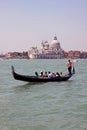 Gondolier, gondola and tourists in Venice