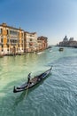 Gondolier pointing towards Basilica di Santa Maria in Venice