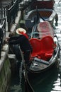 Gondolier preparing boat for tourists,Venice Royalty Free Stock Photo