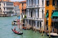 Gondolier rowing gondola with tourists on Grand Canal in Venice, Italy Royalty Free Stock Photo