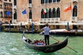 Gondolier rowing gondola with tourists on Grand Canal in Venice, Italy Royalty Free Stock Photo