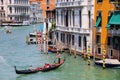 Gondolier rowing gondola with tourists on Grand Canal in Venice, Italy Royalty Free Stock Photo