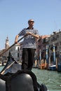 Gondolier rowing gondola in Venice