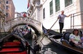 Gondolier and tourists in a gondola