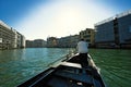 Gondolier traveling down the waterways in Venice, Italy