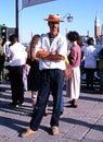 Gondolier on waterfront, Venice.