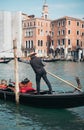 Gondoliers And Gondolas Along The Canals Of Venice