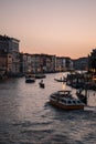 Gondoliers at dusk on the Grand Canal of Venice, Italy