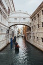 Gondoliers And Gondolas Along The Canals Of Venice