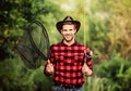 Gone Fishing. fisherman with fishing rod. happy man in cowboy hat. western portrait. Vintage style man. Wild West retro Royalty Free Stock Photo