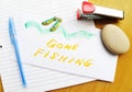 Gone Fishing note on desk Royalty Free Stock Photo
