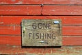 Gone Fishing Sign On A Wooden Plaque Royalty Free Stock Photo