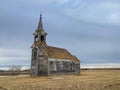 A long time abandoned church still sitting quietly on the quiet prairie Royalty Free Stock Photo