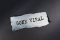 Gone Viral text on torn paper on dark desk in sunlight Royalty Free Stock Photo
