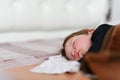 Good baby sleep. Good dreaming new born baby sleep on white towel. New generation of asean people health from first day in life Royalty Free Stock Photo