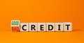 Good or bad credit symbol. Turned wooden cubes and changed concept words Bad credit to Good credit. Beautiful orange table orange Royalty Free Stock Photo