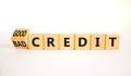 Good or bad credit symbol. Turned wooden cubes and changed concept words Bad credit to Good credit. Beautiful white table white Royalty Free Stock Photo