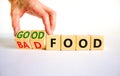 Good or bad food symbol. Doctor turns cubes and changes words `bad food` to `good food`. Beautiful white table, white backgrou Royalty Free Stock Photo