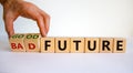 Good or bad future symbol. Businessman turns wooden cubes and changes words `bad future` to `good future`. Beautiful white Royalty Free Stock Photo
