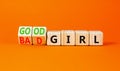 Good or bad girl symbol. Concept word Good girl Bad girl on wooden cubes. Beautiful orange table orange background. Business Royalty Free Stock Photo