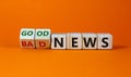 Good or bad news concept. Fliped cubes and changed the words `bad news` to `good news`. Beautiful orange background. Business Royalty Free Stock Photo